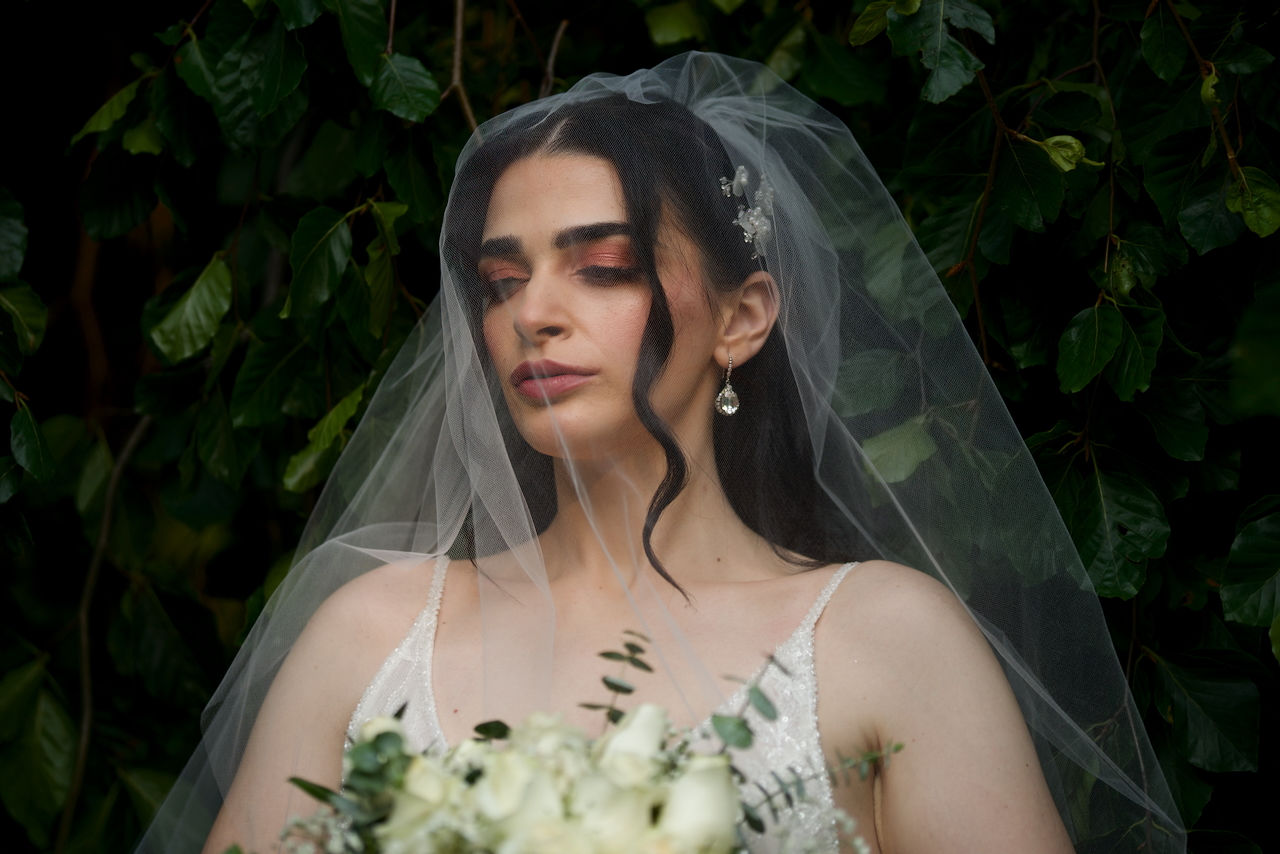 Model in London Ontario bridal portrait shoot with soft curls and natural bridal makeup.