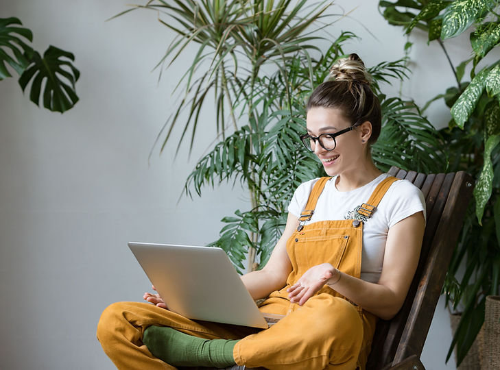 Woman gardener in glasses wearing overal