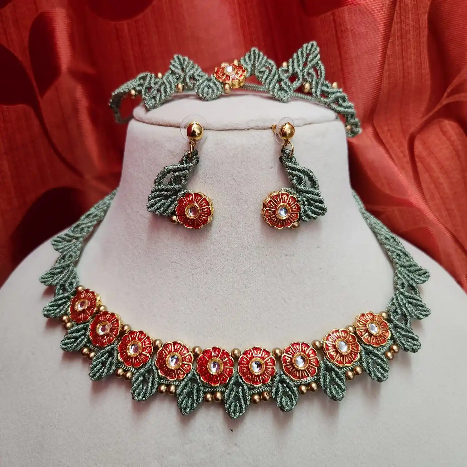 The Prasoona macrame necklace set feature delicate meenakari flowers and macrame leaves