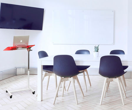 Rolling bedside tray table with adjustable height – convenient for reading, eating, or working from bed or chair"