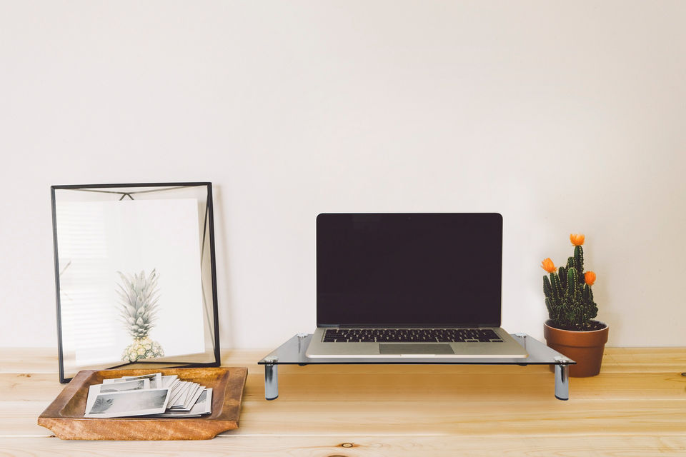 Desktop monitor riser with storage compartments for organizing office supplies and maximizing desk space