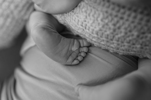 newborn baby feet on mums stomach Liverpool