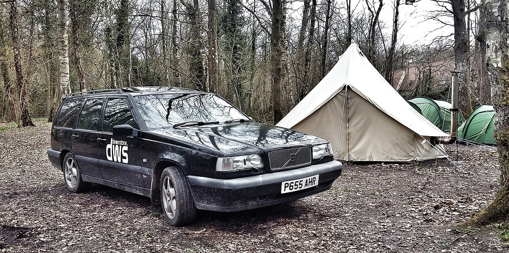 Black Volvo 850 T5 manual estate camping with bell tent