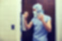 A surgeon enters the operation room.