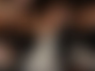 bride and groom dancing together at wedding after party with a large group of people