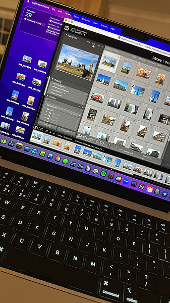 MacBook screen showing Adobe Lightroom Classic open with photo editing and development tools visible.