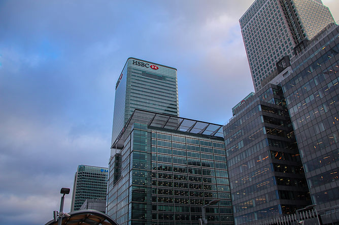 Canary Wharf skyline with modern glass skyscrapers rising above East London.
