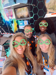 A group of ProSolve employees pose with shamrock sunglasses in celebration of St. Patrick's Day.