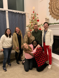 A group photo of ProSolve employees standing in front of a Christmas tree.