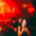 The staircase at the Windmill Soho nightclub on a party night with the crowd dancing in the background.