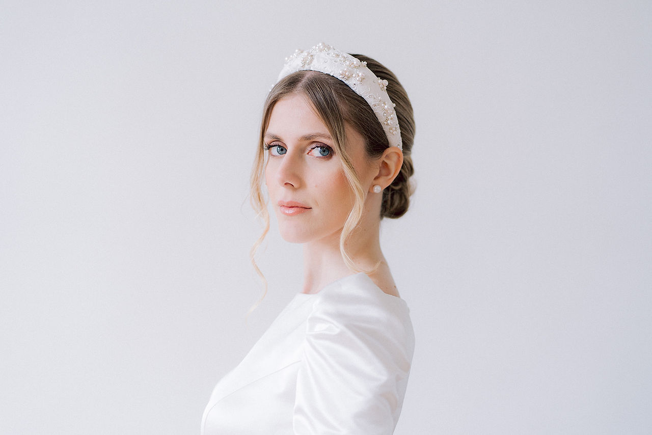 Portrait of the bride staring at the camera in one of the salons of the Chateau de Nainville les Roches