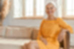 happy middle aged woman on couch