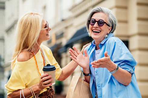 two happy women shopping
