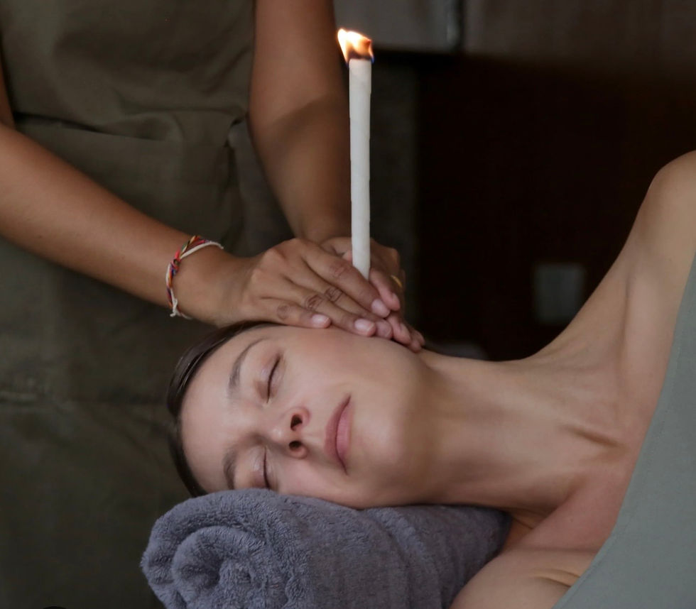 Hopi ear candle treatment being performed on a woman.