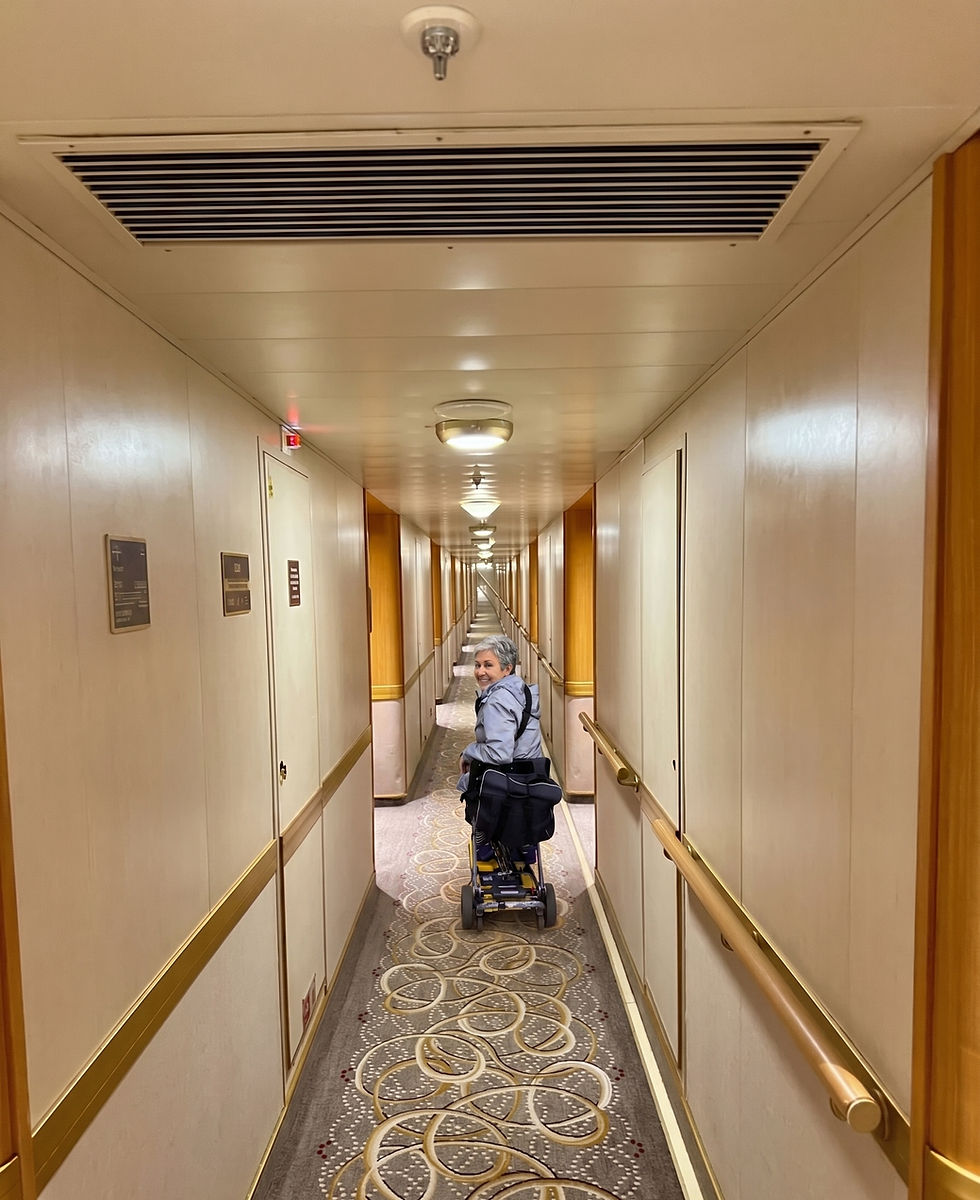 Luggie travel scooter easily fitting through a narrow cruise ship cabin door.