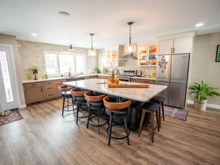 Beautiful kitchen remodel with warm tones and cabinetry storage solutions, designed by Capitol Kitchen and Bath in Springfield, IL
