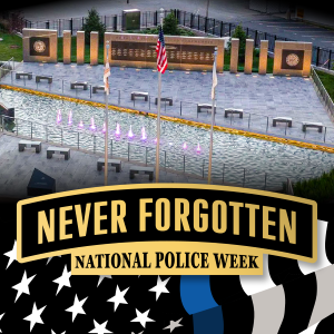 Flyer depicting the Memorial Park in Springfield, IL along with the memo "never forgotten" in honor of national police week. 