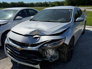 Car damage waiting for repairs at Phoenix Collision in Springfield, IL