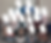 Group of schoolchildren posing in a classroom, seated and standing in rows; faces blurred, with one smiling girl front center.