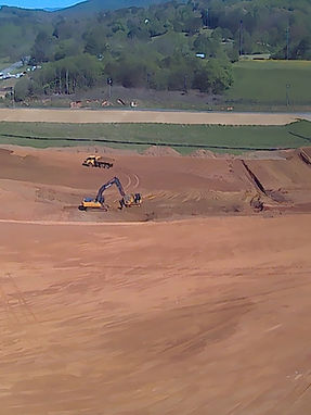 Heavy equipment clearing ground for the new Ledford & Parker headquarters