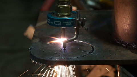 Victor style welding torch attachment cutting a precise circle in metal