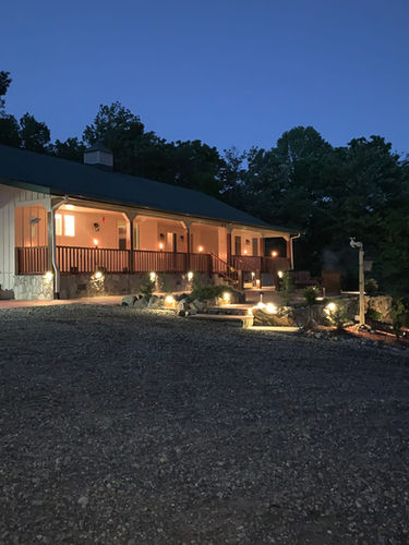 View of the front porch lit up at night.jpeg