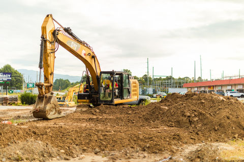Heavy equipment grading land for an NCDOT Project in Hayesville, North Carolina