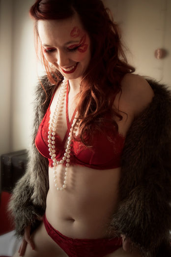 Candid shot of model enjoying her unique boudoir experience