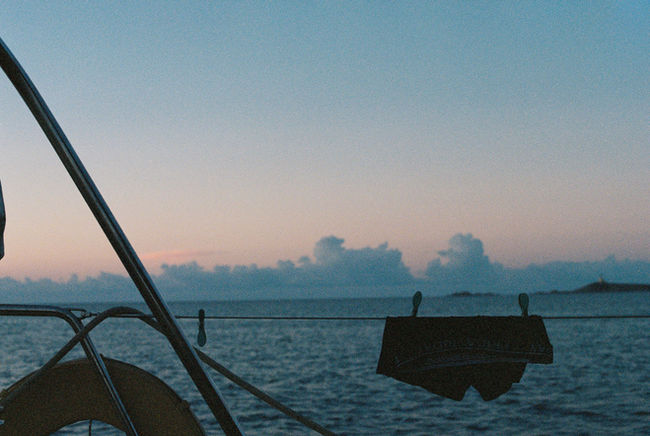 sailboat view early morning sunrise male underwear on the clothing line drying