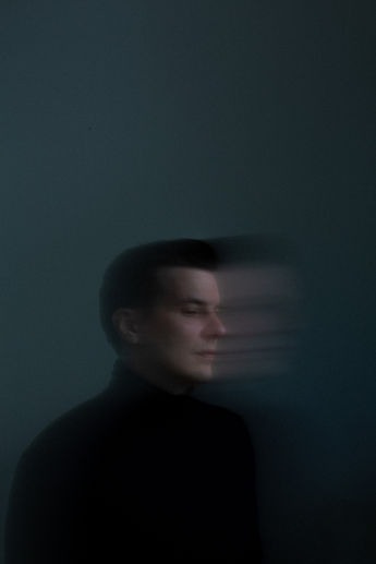 moody dark blue long exposure portrait of David Preissel 