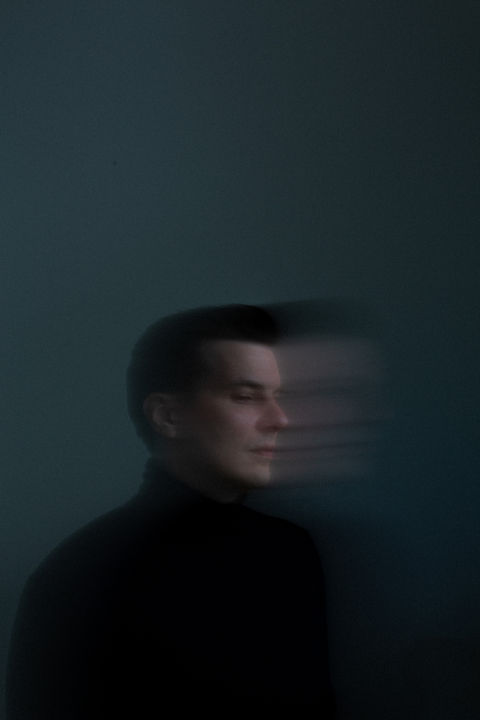moody dark blue long exposure portrait of David Preissel 