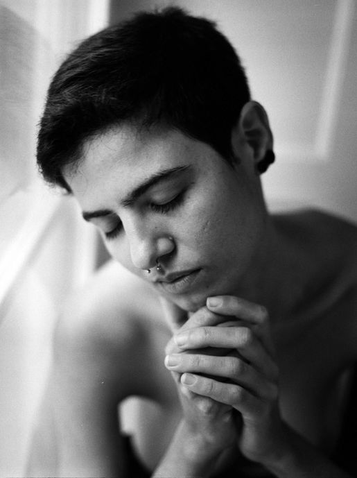 melancholic moody black and white 120 Mamyia Film portrait of a woman with piercing and short hair