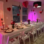 Indoor Valentines party table chairs and linens
