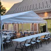 Tents canopies tables and chairs at a wedding