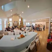 Indoor party with rectangle tables and chairs