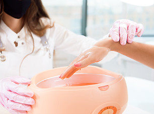 process paraffin treatment of female hands in a beauty salon.jpg