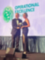 Caroline Henry picking up “Green Operational Excellence” award at the 2025 Operational Excellence Awards