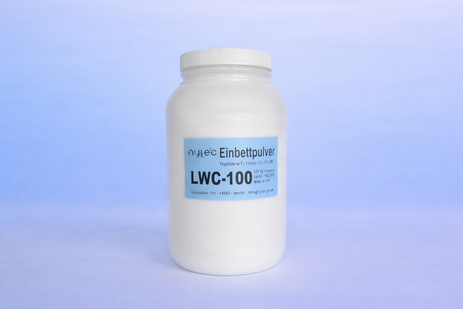 Weißer Behälter mit ADEC Einbettpulver LWC-100, ein Dentalprodukt.