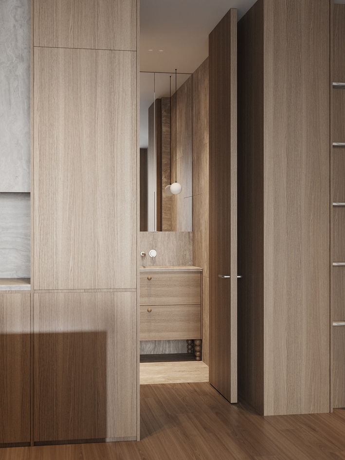 Minimalist wooden interior with a partially open door revealing a vanity, mirror, and hanging globe light.