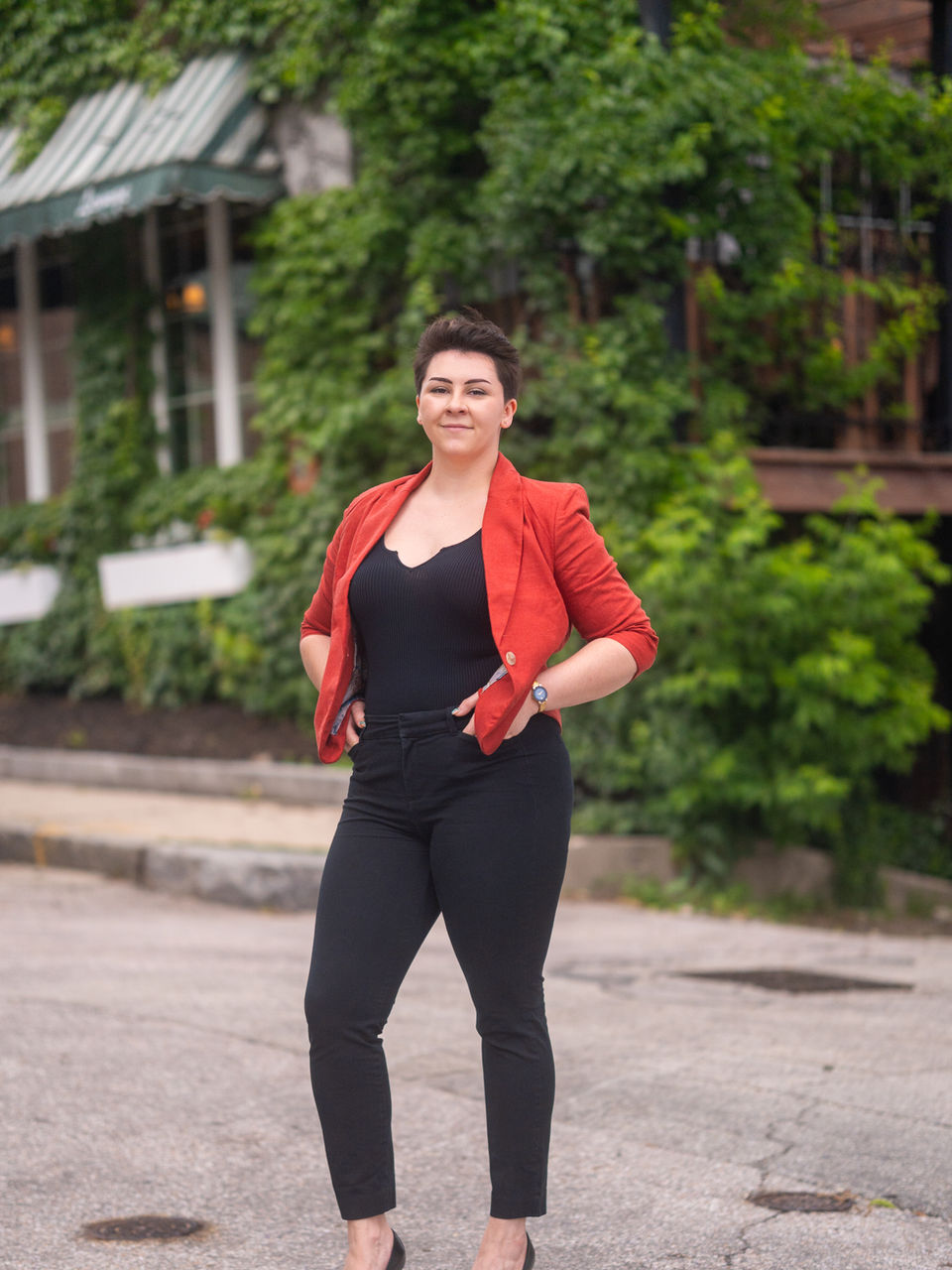 Outdoor urban portrait emphasizing confidence and posture