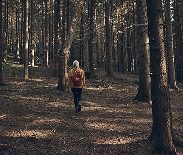 Woman Walking in Forest