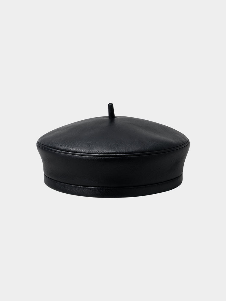 Leather beret hat on white background