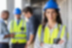 Portrait of woman engineer at building site looking at camera with copy space Mature const