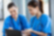 two beautiful female healthcare workers using laptop.jpg