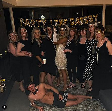 Buff Butler posing for photos with hen party
