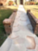 Concrete pathway with flagstone pattern and brick borders