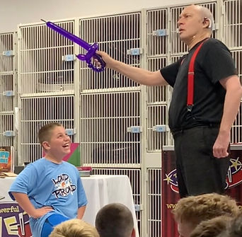 Boy Laughing at Balloon Sword.jpeg