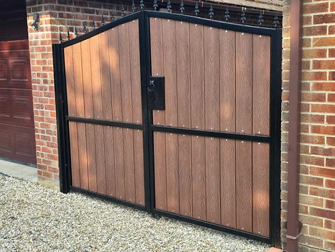 Wooden double gate with black frame