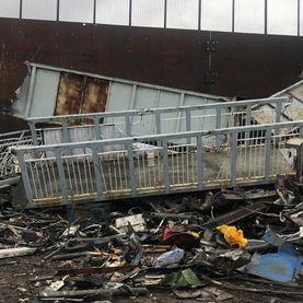 A pile of industrial debris with metal scraps and a rusted platform