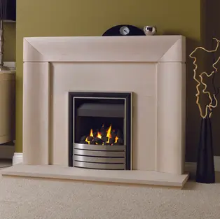 A modern cream fireplace with a sleek, geometric design frames a gas fire